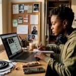 Hip-hop journalist checking news at desk