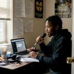 Rapper multitasking with social media at home
