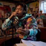 Hip-hop artist recording vocals in studio