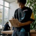 Young rapper working in home music studio