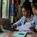 Young woman working on music news sharing
