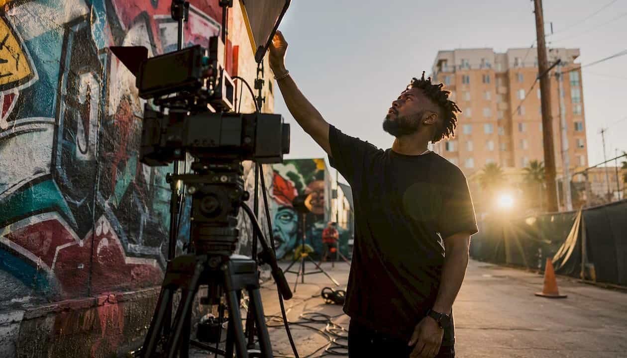 Hip-hop artist adjusting music video lighting
