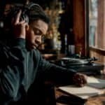 Urban artist listening to mixtapes on headphones