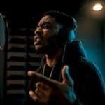 Rapper recording an intense vocal take