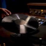 Vinyl record beside hip-hop mastering equipment