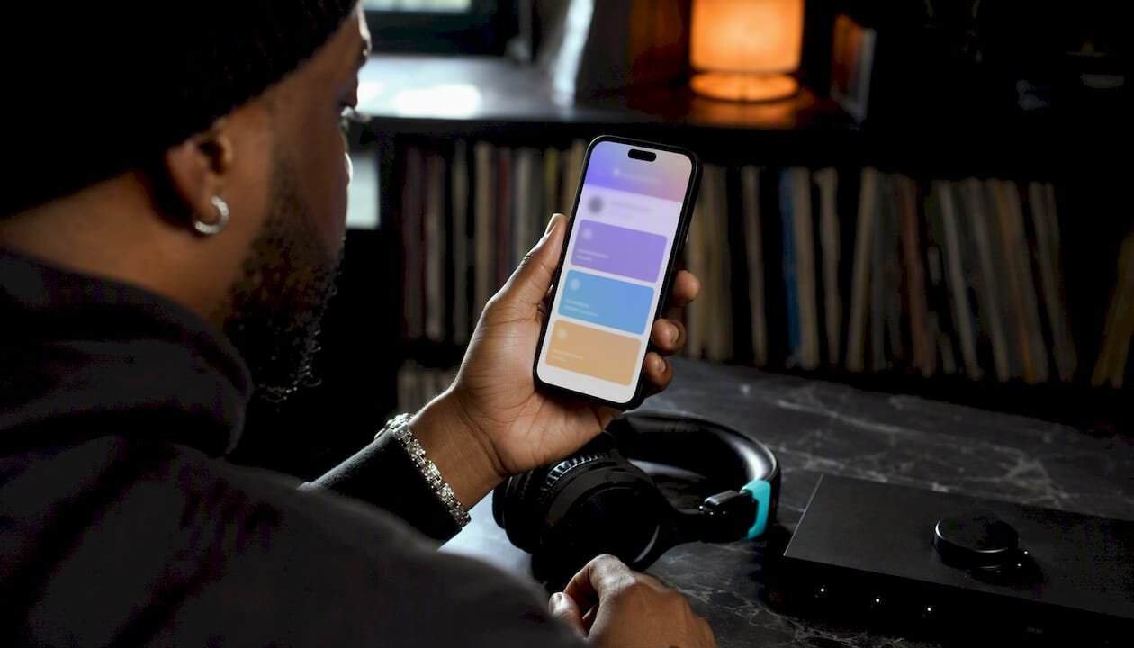 Artist reviewing membership tiers on phone