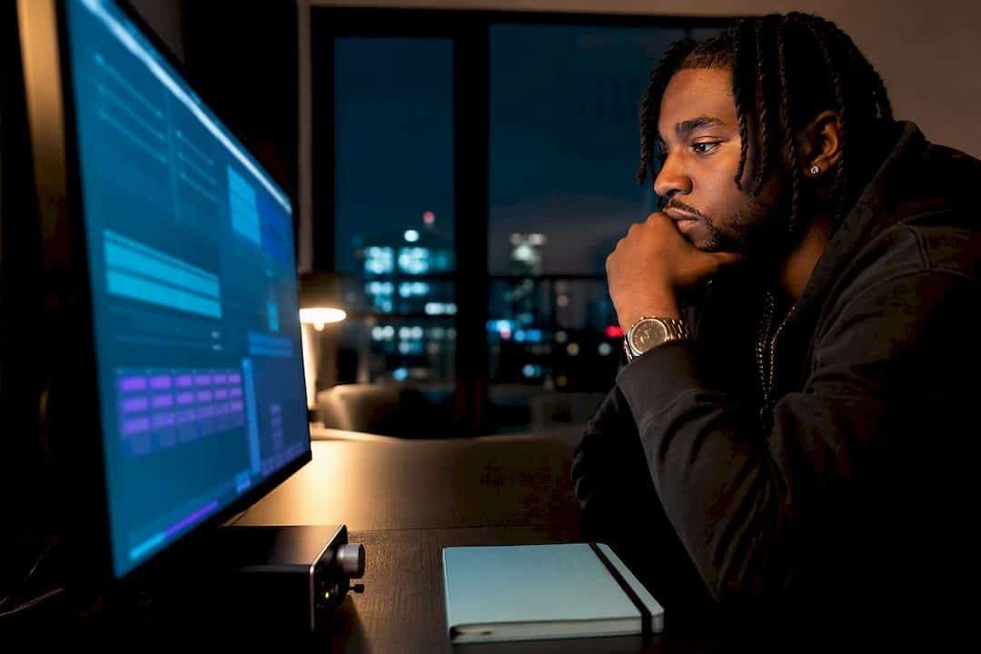 Hip-hop artist reviewing streaming analytics